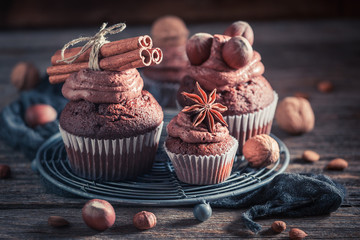 Tasty chocolate cupcake made of cream and nuts