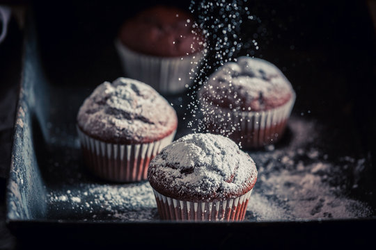 Fresh And Tasty Chocolate Muffin On An Old Baking Tray