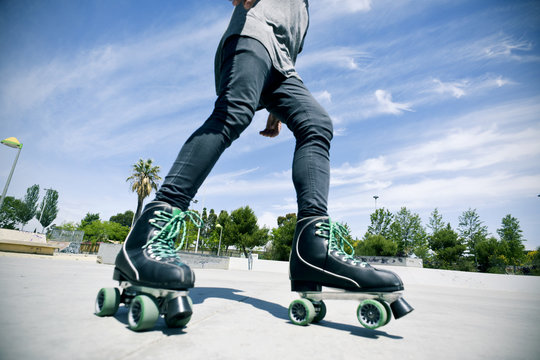young man roller skating in a skate park