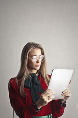 Blonde woman using a tablet