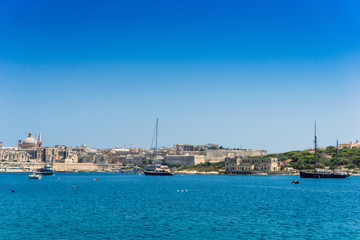 Fototapeta premium Mediterranean traditional colorful boats in Malta