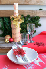 Christmas table. Bottle, glass,plate