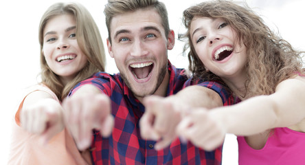 closeup of three happy young people showing hands forward