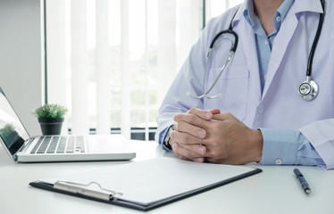 Close up of doctor filling up an history form while consulting patient and think about finding a cure for a diagnosis, treatment methods to rehabilitate the body