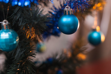 Christmas tree on wall background, yellow lights,