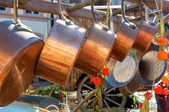 Culinary products from the market. Hanging copper cookers.