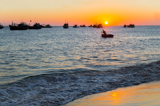 Vietnam village fishing boats ships sunset light