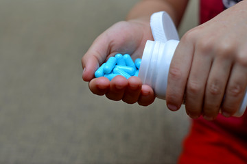 Small child taking medicine