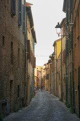 Fano, Italy - August 8, 2017: Narrow streets of the old city at night sometimes.