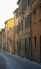 Fano, Italy - August 8, 2017: Narrow streets of the old city at night sometimes.