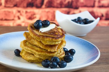 Pancakes with syrup and blueberries