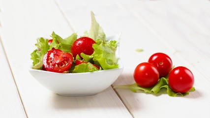 Small bowl of lettuce and tomato salad