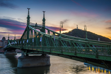 Budapest, Hungary - The beautiful Liberty Bridge at suset with amazing colorful sky and clouds