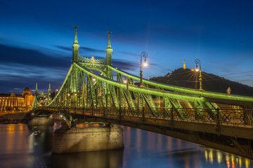 Budapest, Hungary - The beautiful Liberty Bridge (Szabadsag hid) at blue hour with Statue of Liberty at background
