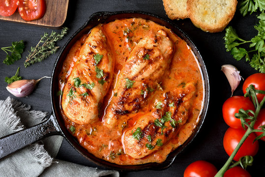 Tasty chicken breast with tomato sauce