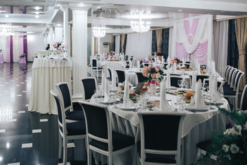 the restaurant, set tables with white table cloths