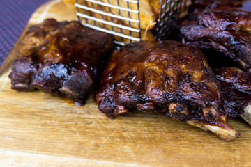 Grilled steak - Grilled meat ribs on the plate with hot sauce