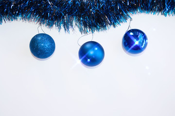 blue Christmas balls on white background