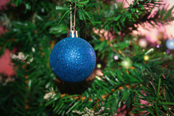 bright blue Christmas balls hanging on the tree