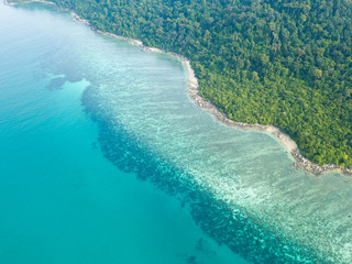 Aerail view of coral reef and turquoise water along the tropical island in Phuket Thailand