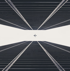 Plane between skyscrapers