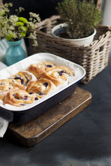 sweet homemade pastries with berries and chocolate. in a blue tray