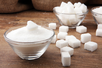 Various types of sugar, white sugar on wooden table.