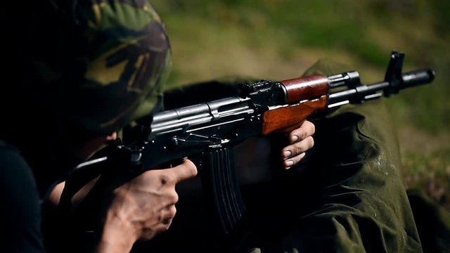 Outdoor shooting with automatic rifle in a shooting range