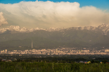 Obraz premium Almaty city panoramic view, Kazakhstan. Cloudy sky, mountains
