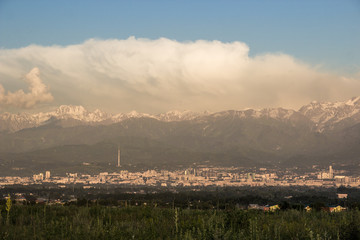 Almaty city panoramic view, Kazakhstan. Cloudy sky, mountains