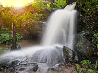Waterfall by water outflow from mini hydro power plant