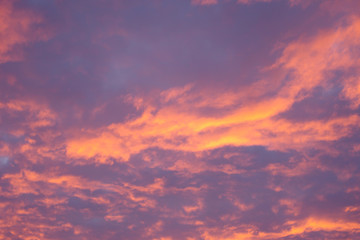 Orange and blue clouds at sunset. Cloudscape background or texture. Red sky at night shepherds delight.