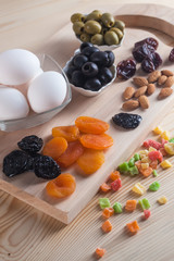 Olives, eggs, juice and other products on the table, healthy meals