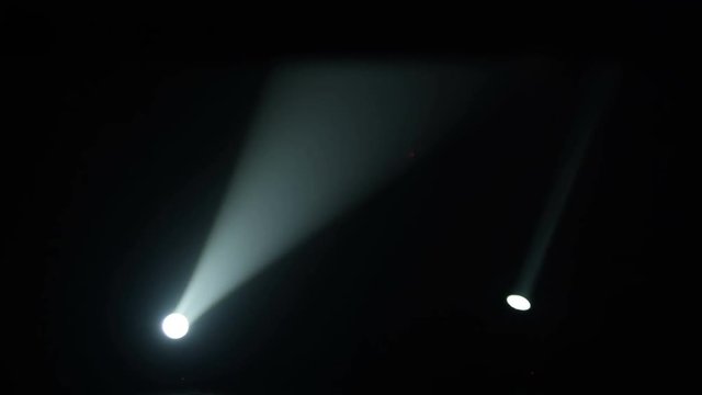 Realistic footage of stage light flashing rays spotlights through smoke. Great as a natural stage background for different projects!!!