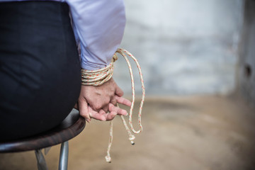 ฺBack view of a business woman with a rope