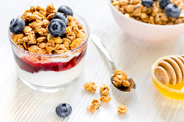 Healthy morning with granola breakfast on white kitchen table