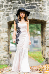 Filipino model in a local park at Autumn time surrounded by lush foliage at daytime