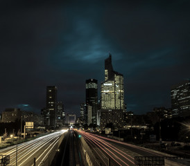 Fototapeta na wymiar Modern city at night with cars light lines.
