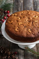 Homemade Christmmas Fruit cake on rustic wooden background