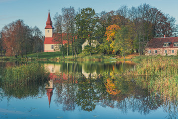 Farewell to Autumn as the final leaf-fall has begun. Sunny October day at Āraiši lake with...