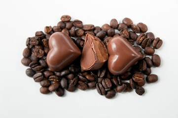 heart shapes chocolate pralines on coffee beans