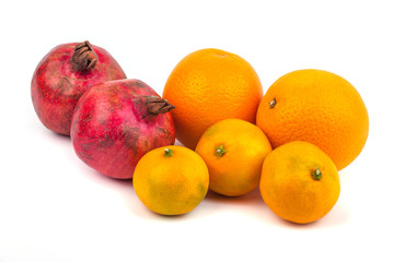 Orange mandarin, tangerine and pomegranate fruit isolated on white background