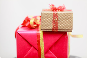 Two gift boxes red and golden