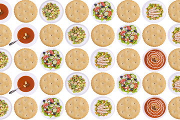 Obraz premium Rows of cracker biscuits, soups and salads isolated on white background.