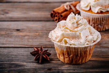 Pumpkin cupcakes decorated with cream cheese frosting