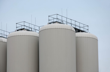Production. Industrial buildings in the blue sky
