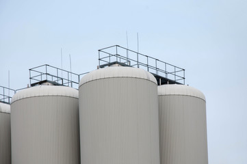 Production. Industrial buildings in the blue sky
