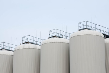 Production. Industrial buildings in the blue sky
