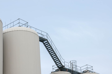 Production. Industrial buildings in the blue sky
