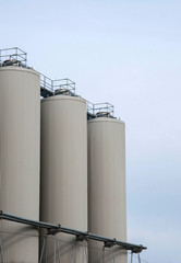 Production. Industrial buildings in the blue sky
